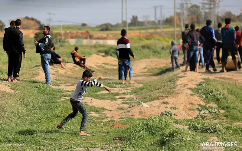 Palestinian protesters clash with Israeli security forces in response to the United States' decision to recognize Jerusalem as the Capital of Israel near the border with Israel in east of Gaza city on March 16, 2018. Aft...