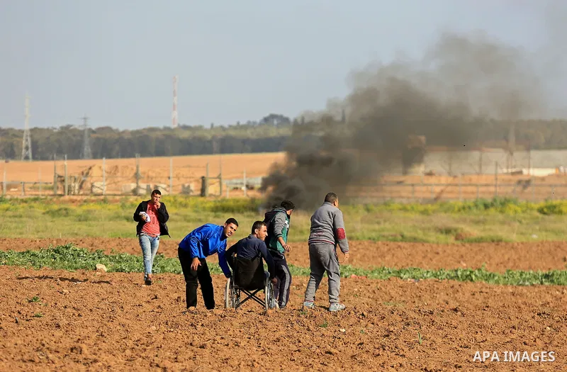 Palestinian protesters clash with Israeli security forces in response to the United States' decision to recognize Jerusalem as the Capital of Israel near the border with Israel in east of Gaza city on March 16, 2018. Aft...