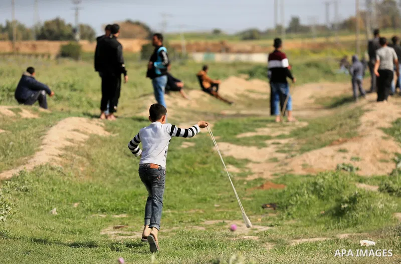 Palestinian protesters clash with Israeli security forces in response to the United States' decision to recognize Jerusalem as the Capital of Israel near the border with Israel in east of Gaza city on March 16, 2018. Aft...