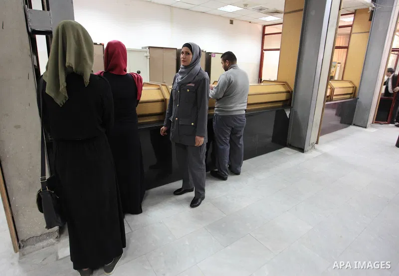 A Palestinian woman security guard from Secure Land company for security and logistics services takes part in a work day at bank of Palestine in Gaza City on March 19, 2018. Secure land is the first security company for...