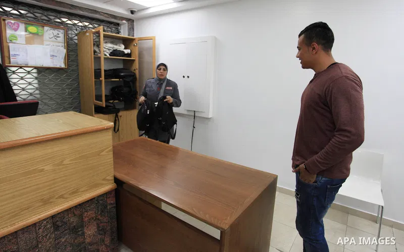 A Palestinian woman security guard from Secure Land company for security and logistics services takes part in a work day at bank of Palestine in Gaza City on March 19, 2018. Secure land is the first security company for...