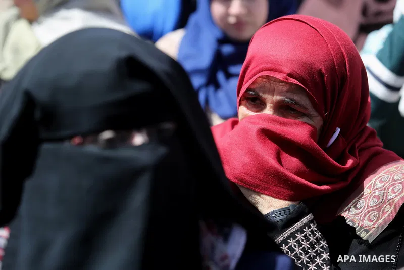 Relatives of Palestinian engineers who protest inside UNRWA headquarters since 25 days, take part during a demonstration on the occasion of Mother's Day, outside the headquarters United Nations Relief and Works Agency (U...