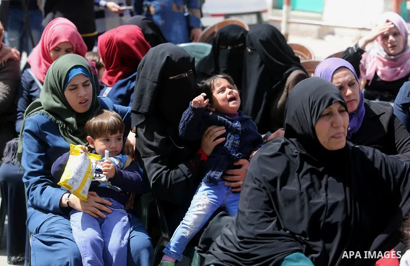 Relatives of Palestinian engineers who protest inside UNRWA headquarters since 25 days, take part during a demonstration on the occasion of Mother's Day, outside the headquarters United Nations Relief and Works Agency (U...
