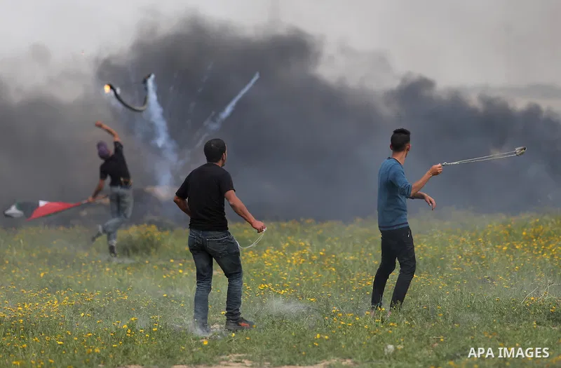 Palestinian protesters clash with Israeli security forces in response to the United States' decision to recognize Jerusalem as the Capital of Israel near Khan Yunis by the border fence between Israel and the southern Gaz...