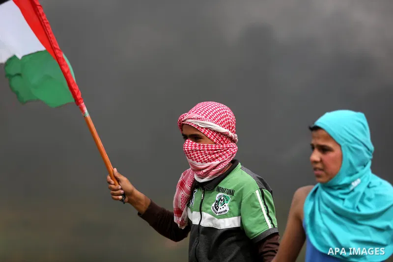 Palestinian protesters clash with Israeli security forces in response to the United States' decision to recognize Jerusalem as the Capital of Israel near Khan Yunis by the border fence between Israel and the southern Gaz...