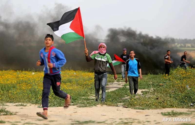 Palestinian protesters clash with Israeli security forces in response to the United States' decision to recognize Jerusalem as the Capital of Israel near Khan Yunis by the border fence between Israel and the southern Gaz...