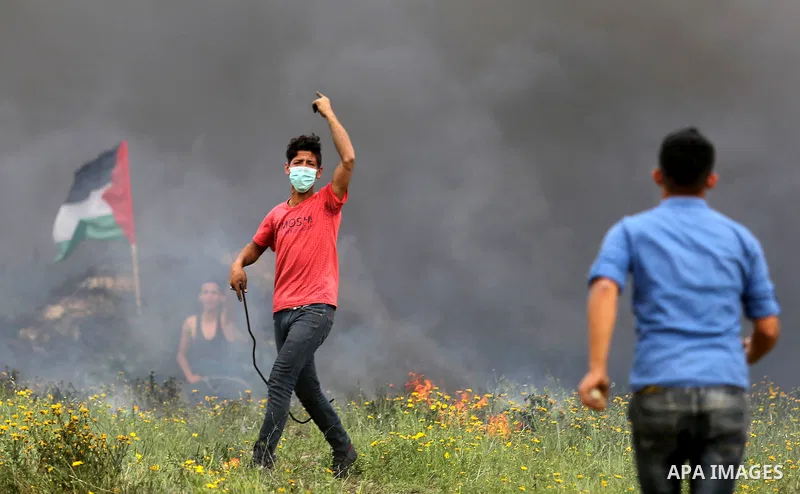 Palestinian protesters clash with Israeli security forces in response to the United States' decision to recognize Jerusalem as the Capital of Israel near Khan Yunis by the border fence between Israel and the southern Gaz...