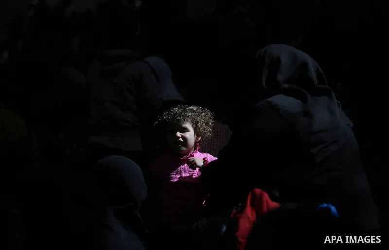Palestinians wait for travel permits to cross into Egypt through the Rafah border crossing after it was opened by Egyptian authorities for humanitarian cases, in Khan Yunis in the southern Gaza Strip on March 24, 2018. P...