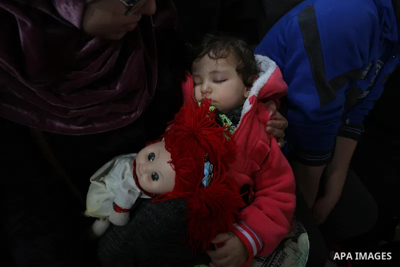 Palestinians wait for travel permits to cross into Egypt through the Rafah border crossing after it was opened by Egyptian authorities for humanitarian cases, in Khan Yunis in the southern Gaza Strip on March 24, 2018. P...