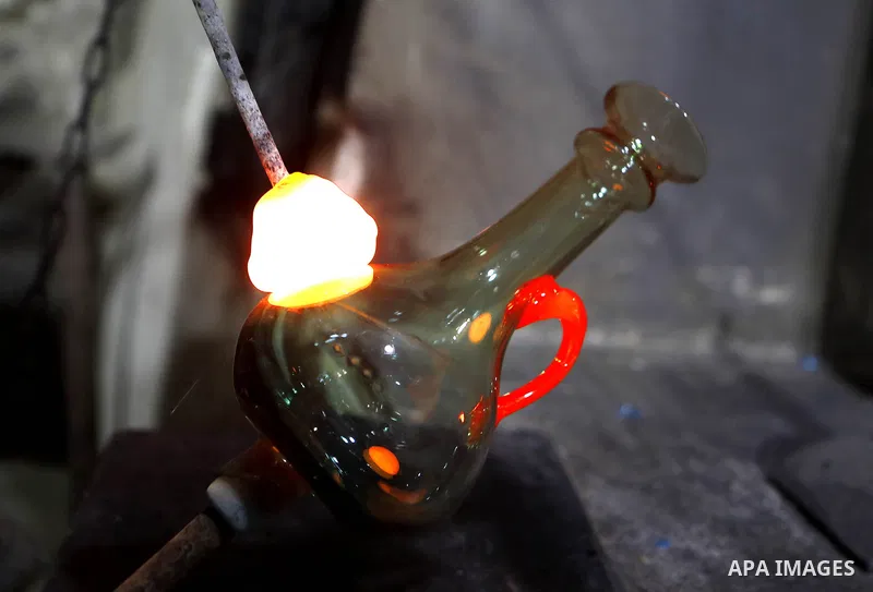 A Palestinian Yaacqoub al-Natsheh, professional glassblower who has been forming glass for over 40 years, works at his new workshop near the Ibrahimi Mosque, in the West Bank city of Hebron, March 25, 2018. Photo by Wisa...