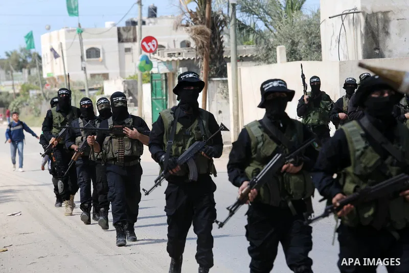 Members of Hamas' armed wing al-Qassam Brigades take Part in a military drill at al-Nusairat refugee camp in the central Gaza Strip, on March 25, 2018. Photo by Ashraf Amra