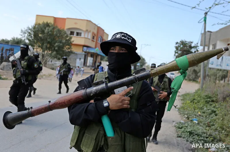 Members of Hamas' armed wing al-Qassam Brigades take Part in a military drill at al-Nusairat refugee camp in the central Gaza Strip, on March 25, 2018. Photo by Ashraf Amra