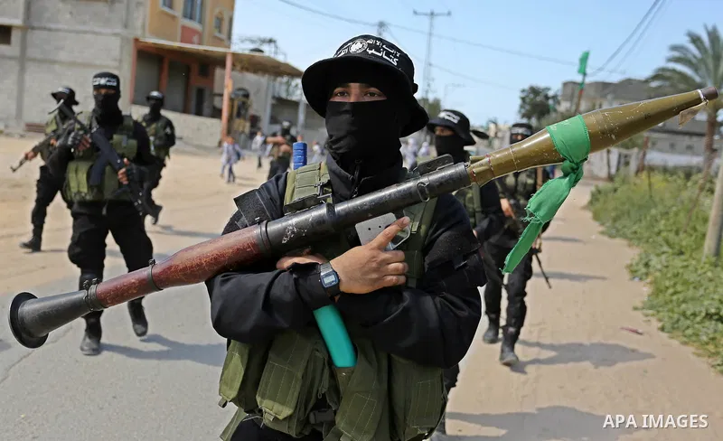 Members of Hamas' armed wing al-Qassam Brigades take Part in a military drill at al-Nusairat refugee camp in the central Gaza Strip, on March 25, 2018. Photo by Ashraf Amra