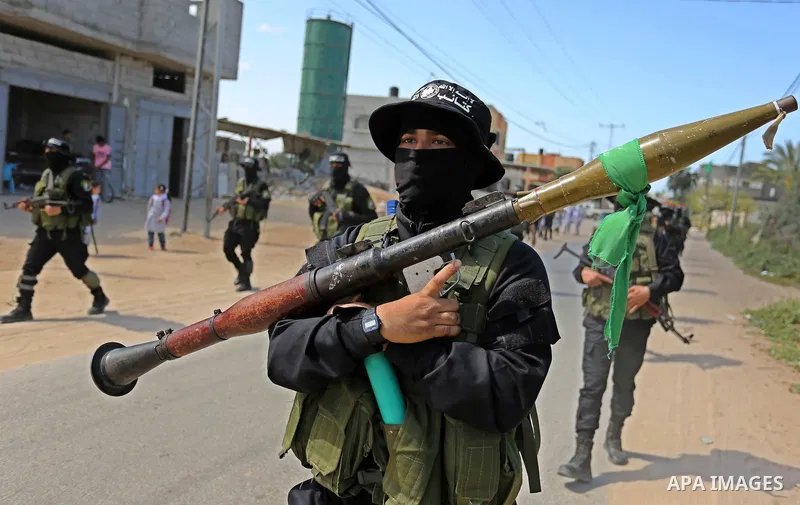 Members of Hamas' armed wing al-Qassam Brigades take Part in a military drill at al-Nusairat refugee camp in the central Gaza Strip, on March 25, 2018. Photo by Ashraf Amra
