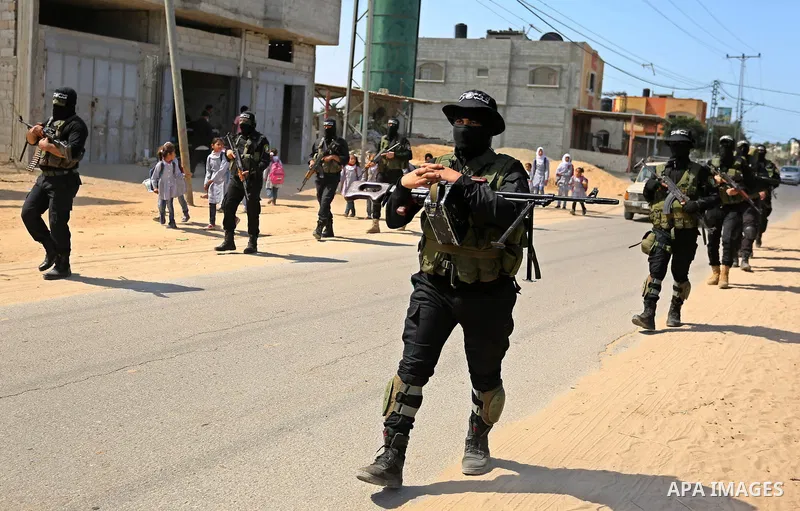 Members of Hamas' armed wing al-Qassam Brigades take Part in a military drill at al-Nusairat refugee camp in the central Gaza Strip, on March 25, 2018. Photo by Ashraf Amra