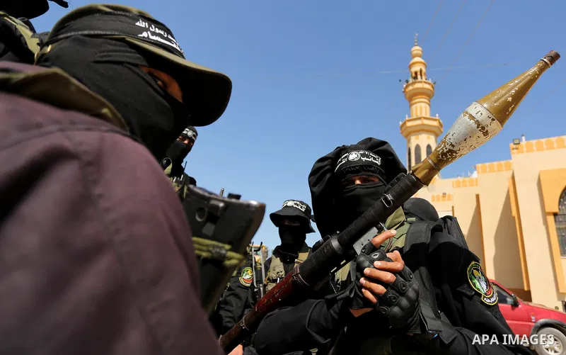 Members of Hamas' armed wing al-Qassam Brigades take Part in a military drill at al-Nusairat refugee camp in the central Gaza Strip, on March 25, 2018. Photo by Ashraf Amra