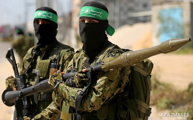 Members of Hamas' armed wing al-Qassam Brigades take Part in a military drill at al-Nusairat refugee camp in the central Gaza Strip, on March 25, 2018. Photo by Ashraf Amra