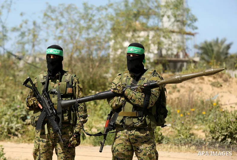 Members of Hamas' armed wing al-Qassam Brigades take Part in a military drill at al-Nusairat refugee camp in the central Gaza Strip, on March 25, 2018. Photo by Ashraf Amra