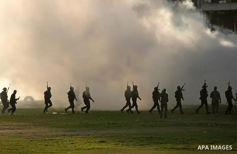 Members of Hamas' armed wing al-Qassam Brigades take Part in a military drill in Gaza city on March 25, 2018. Photo by Ashraf Amra