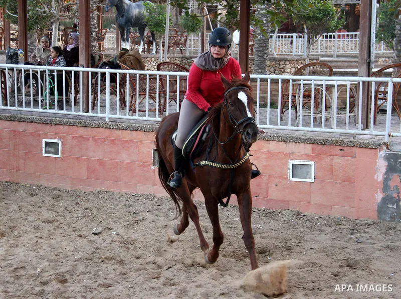 Palestinian woman Afnan al-Hayek, 31, rides her horse during a training, in Gaza city on March 26, 2018. Al-Hayek participated in many equestrian competitions and she seeks to represent Palestine in international forums....