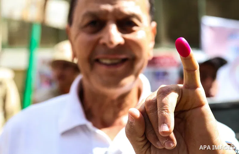 An Egyptian man shows his ink-stained pinky finger after casting his vote at a polling station, in Cairo, Egypt, on March 26, 2018. Egyptians head to the polls in a three-day vote to choose between incumbent Abdel Fattah...