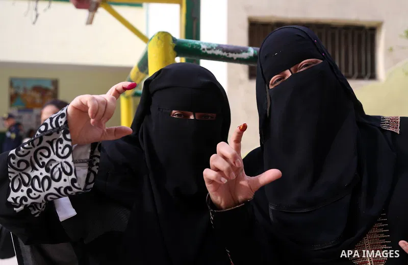 Egyptian women show their ink-stained fingers after casting her vote at a polling station, in Cairo, Egypt, on March 26, 2018. Egyptians head to the polls in a three-day vote to choose between incumbent Abdel Fattah al-S...