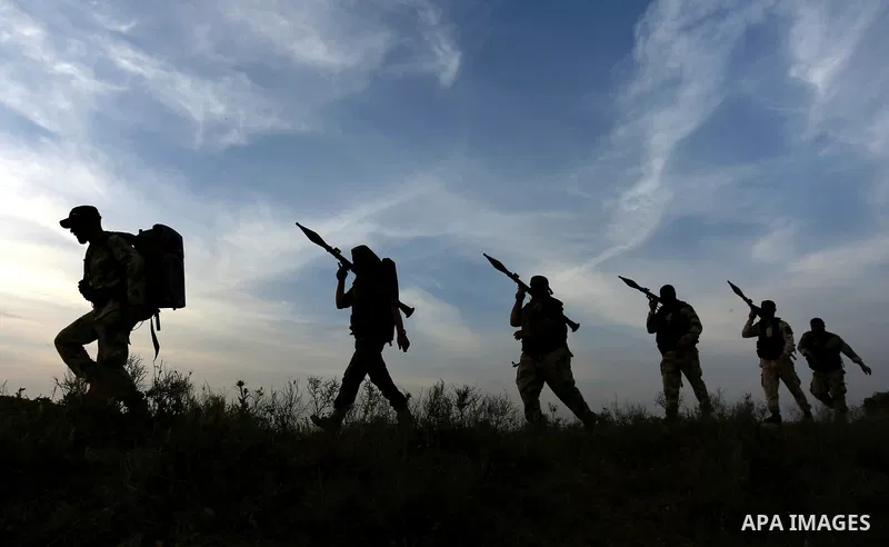Palestinian Islamic Jihad militants march during a military drill in Khan Yunis in the southern Gaza Strip March 27, 2018. Photo by Ashraf Amra