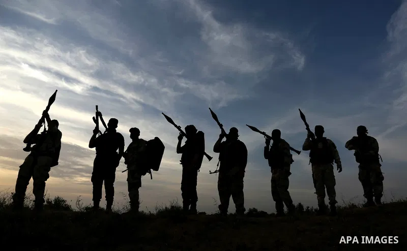 Palestinian Islamic Jihad militants march during a military drill in Khan Yunis in the southern Gaza Strip March 27, 2018. Photo by Ashraf Amra