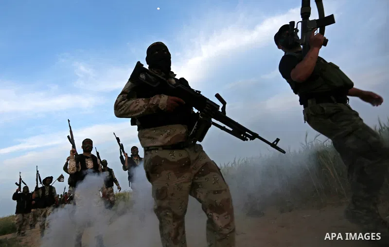 Palestinian Islamic Jihad militants march during a military drill in Khan Yunis in the southern Gaza Strip March 27, 2018. Photo by Ashraf Amra