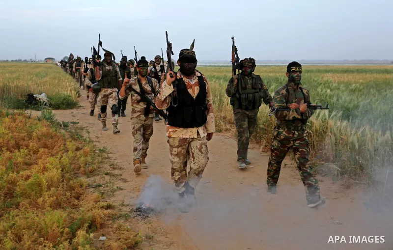 Palestinian Islamic Jihad militants march during a military drill in Khan Yunis in the southern Gaza Strip March 27, 2018. Photo by Ashraf Amra