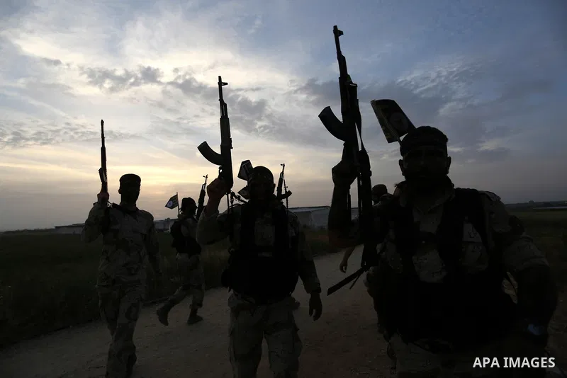Palestinian Islamic Jihad militants march during a military drill in Khan Yunis in the southern Gaza Strip March 27, 2018. Photo by Ashraf Amra