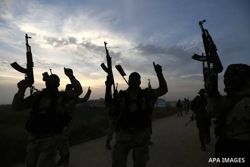 Palestinian Islamic Jihad militants march during a military drill in Khan Yunis in the southern Gaza Strip March 27, 2018. Photo by Ashraf Amra