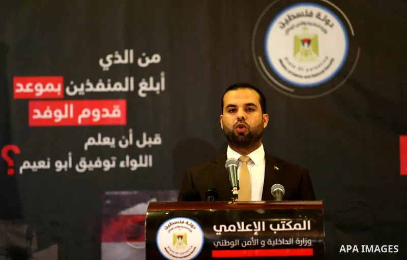 Iyad al-Bozum, an interior ministry spokesman in Gaza Strip speaks during a press conference about the investigations of an explosion that targeted the convoy of Palestinian Prime Minister Rami Hamdallah, in Gaza city on...