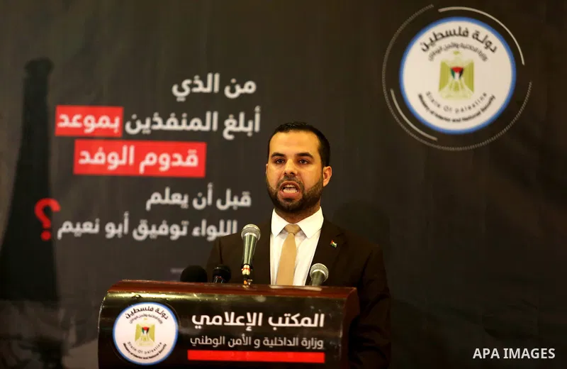 Iyad al-Bozum, an interior ministry spokesman in Gaza Strip speaks during a press conference about the investigations of an explosion that targeted the convoy of Palestinian Prime Minister Rami Hamdallah, in Gaza city on...