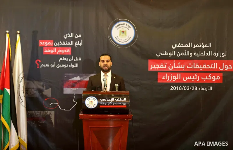 Iyad al-Bozum, an interior ministry spokesman in Gaza Strip speaks during a press conference about the investigations of an explosion that targeted the convoy of Palestinian Prime Minister Rami Hamdallah, in Gaza city on...