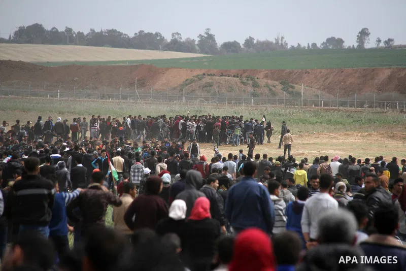 Palestinians take part in a tent city protest along the Israel border with Gaza, demanding the right to return to their homeland, east of Jabalia, in the northern of Gaza Strip on March 30, 2018. Photo by Mahmoud Ajour