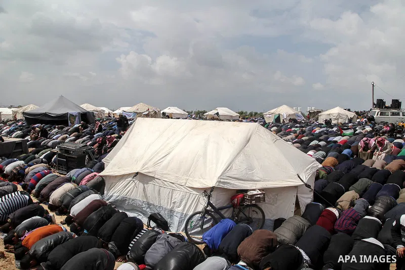 Palestinian Muslim worshippers perform Friday noon prayers during a tent city protest along the Israel border with Gaza, demanding the right to return to their homeland, east of Jabalia, in the northern of Gaza Strip on...