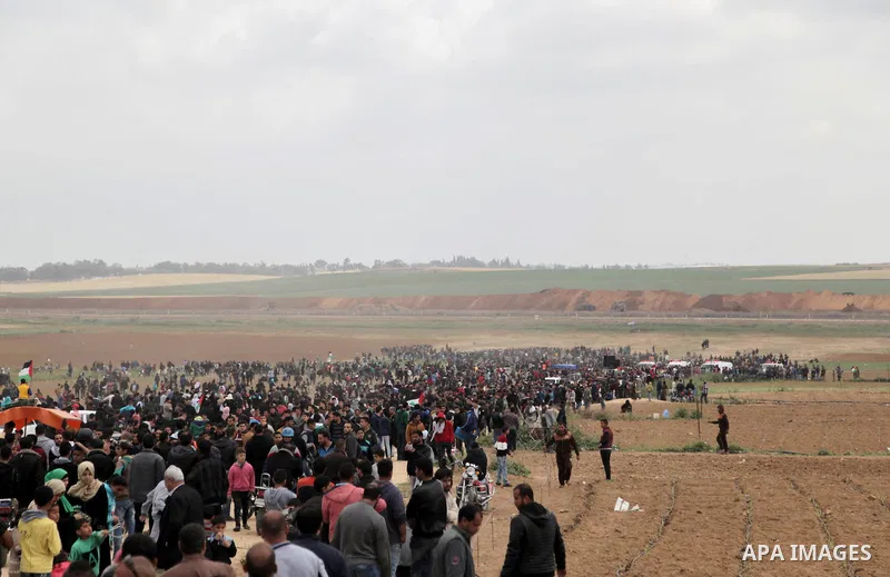 Palsetinians take part during a tent city protest along the Israel border with Gaza, demanding the right to return to their homeland, east of Jabalia, in the northern of Gaza Strip on March 30, 2018. Photo by Ramez Habbo...