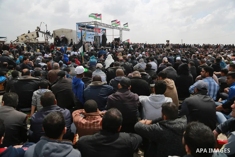 Palestinian Muslim worshippers perform Friday noon prayers during a tent city protest along the Israel border with Gaza, demanding the right to return to their homeland, east of Gaza City March 30, 2018. Photo by Mohamme...
