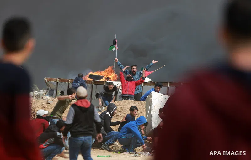 Palestinians take part in a tent city protest along the Israel border with Gaza, demanding the right to return to their homeland, east of Gaza City March 30, 2018. Photo by Mohammed Dahman