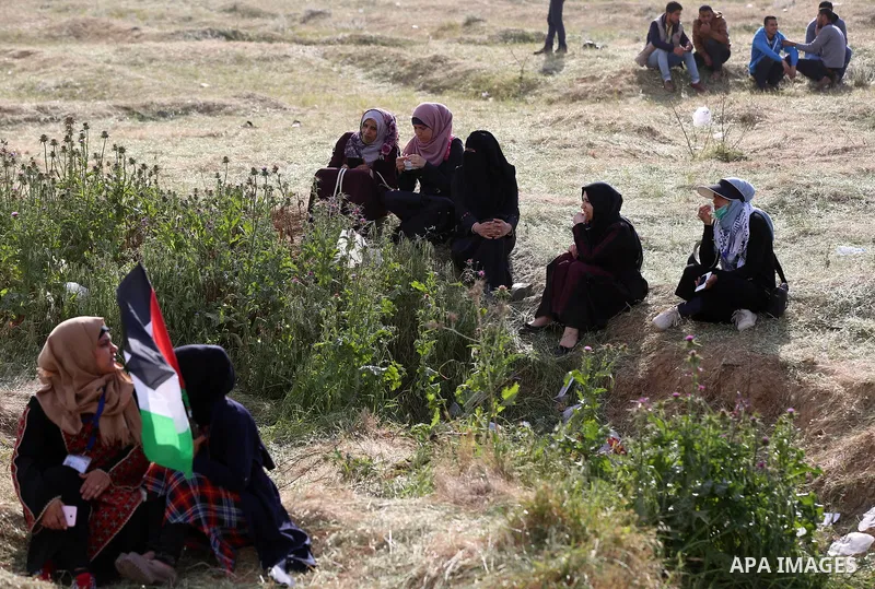 Palestinian women take part during a tent city protest at along the Israel border with Gaza, demanding the right to return to their homeland, in al-Bureij in the center of Gaza strip on March 30, 2018. Photo by Yasser Qu...