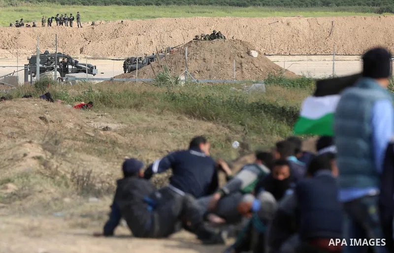 Israeli security forces are seen in Israeli side during clashes with Palestinian protesters in a tent city protest at along the Israel border with Gaza, demanding the right to return to their homeland, in al-Bureij in th...