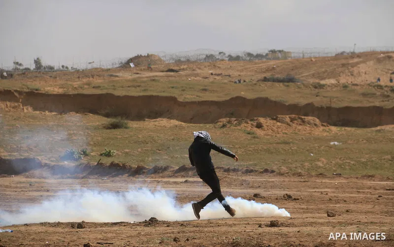 Palestinian protesters clash with Israeli security forces in a tent city protest at along the Israel border with Gaza, demanding the right to return to their homeland, in al-Bureij in the center of Gaza strip on March 30...