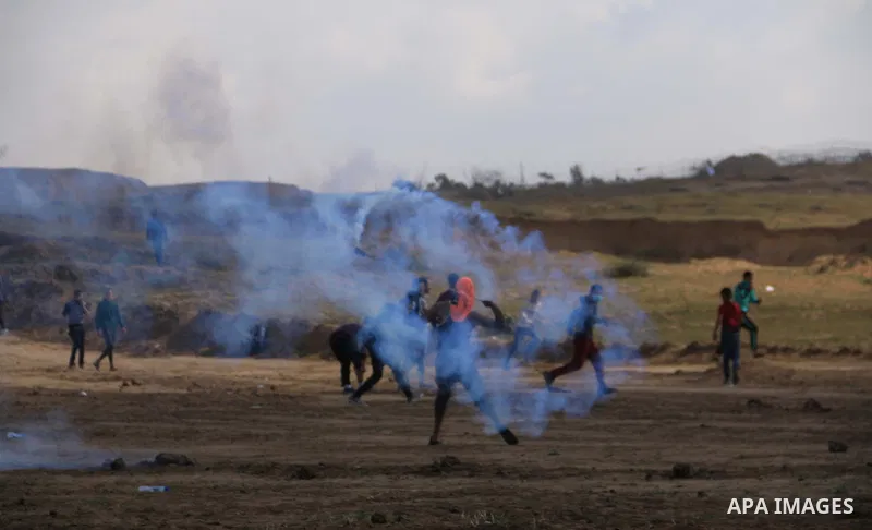 Palestinian protesters clash with Israeli security forces in a tent city protest at along the Israel border with Gaza, demanding the right to return to their homeland, in al-Bureij in the center of Gaza strip on March 30...