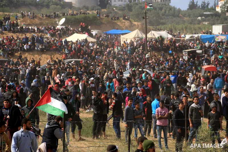 Palestinian protesters clash with Israeli security forces in a tent city protest at along the Israel border with Gaza, demanding the right to return to their homeland, in al-Bureij in the center of Gaza strip on March 30...