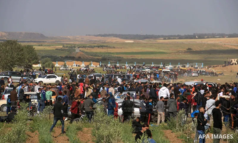 Palestinian protesters clash with Israeli security forces in a tent city protest at along the Israel border with Gaza, demanding the right to return to their homeland, in al-Bureij in the center of Gaza strip on March 30...