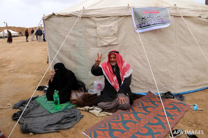 Palestinians take part during a tent city protest along the Israel border with Gaza, demanding the right to return to their homeland, in al-Bureij in the center of Gaza strip on March 30, 2018. Photo by Mahmoud Khattab