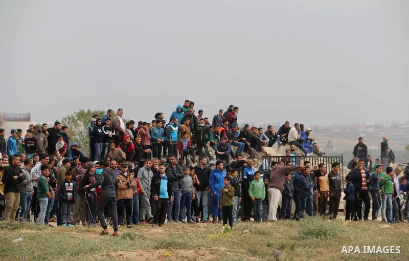 Palestinian protesters clash with Israeli security forces in a tent city protest at along the Israel border with Gaza, demanding the right to return to their homeland, in al-Bureij in the center of Gaza strip on March 30...