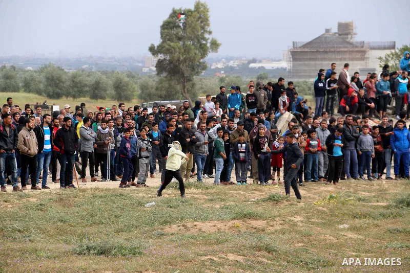 Palestinian protesters clash with Israeli security forces in a tent city protest at along the Israel border with Gaza, demanding the right to return to their homeland, in al-Bureij in the center of Gaza strip on March 30...