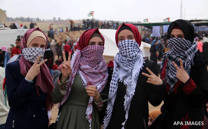Palestinians take part during a tent city protest along the Israel border with Gaza, demanding the right to return to their homeland, in al-Bureij in the center of Gaza strip on March 30, 2018. Photo by Mahmoud Khattab